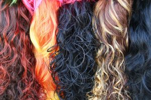 Background texture with stacks of colored wavy hair